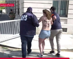 RN கூட்டத்தில் மேலாடையின்றி தோன்றிய  மூன்று பெண் ஆர்வலர்கள்